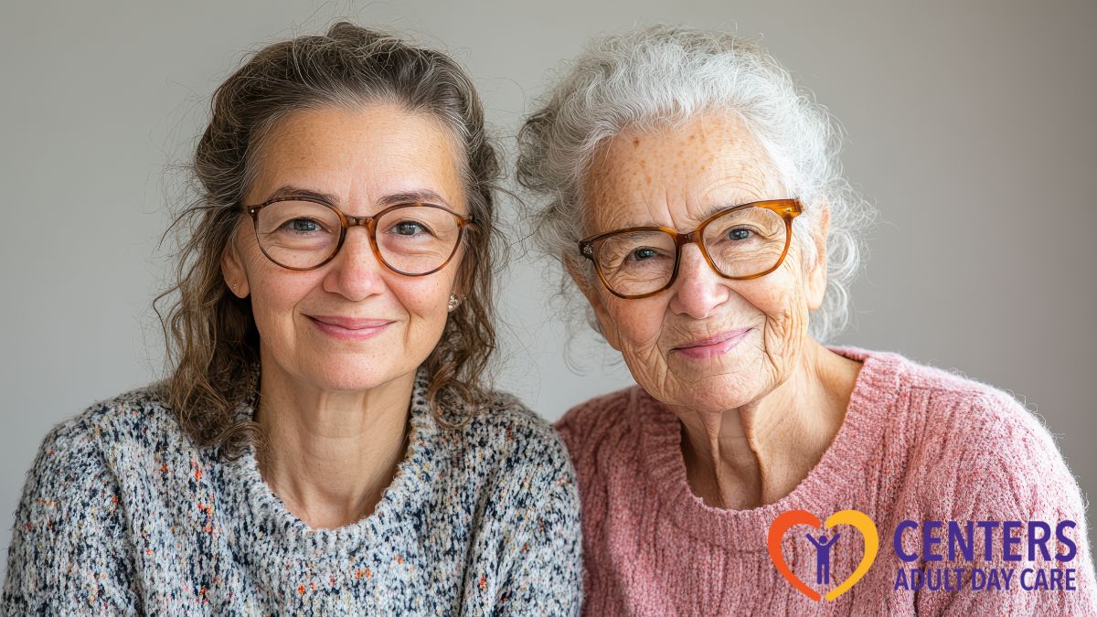 Two elderly women from an adult day care center smile at the camera, appearing happy and content as close friends.