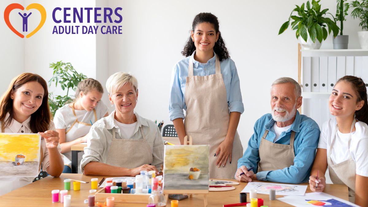 Group of seniors posing for the camera while enjoying a day of arts and crafts activities at a daycare or nursing home.